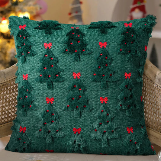 Knitted festive cushion cover on a sofa, styled for the holidays