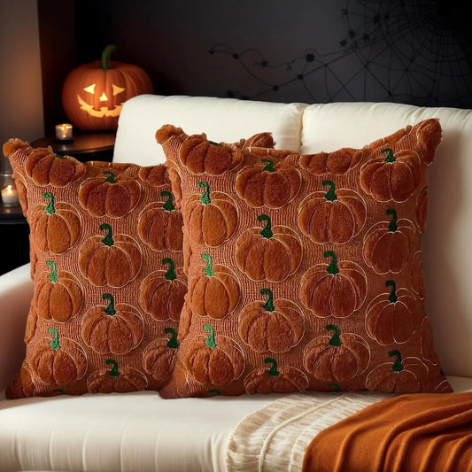 Faux fur cushion covers layered on a sofa for autumn and winter