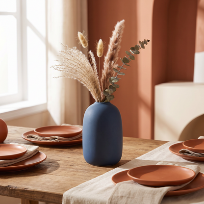 Simple solid color Nordic ceramic vase with narrow neck on a shelf