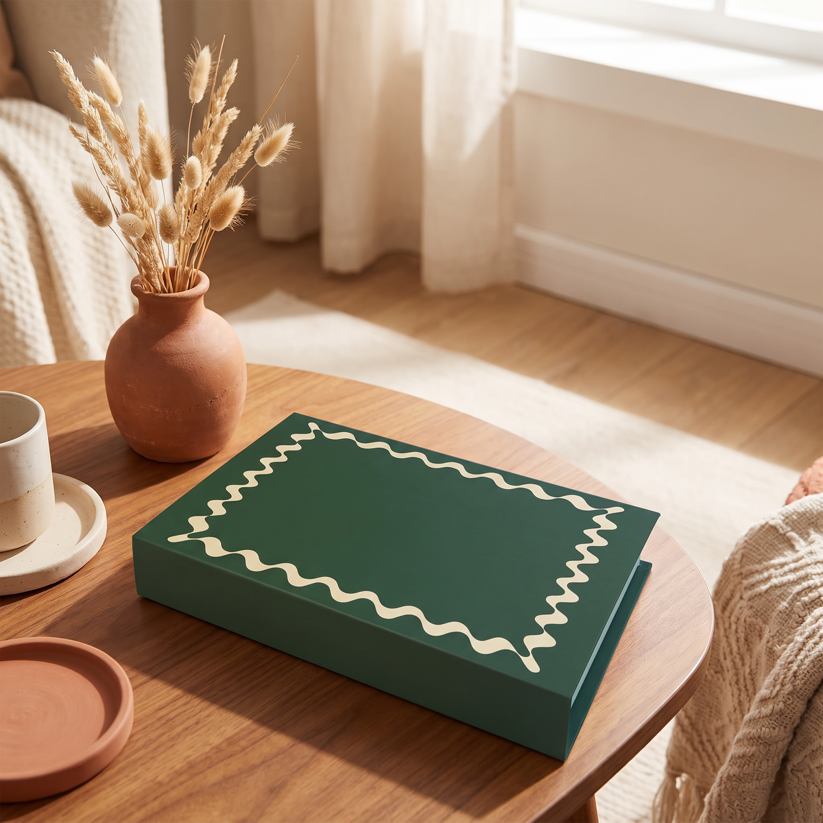 Book-shaped decorative storage box on a coffee table with a small vase