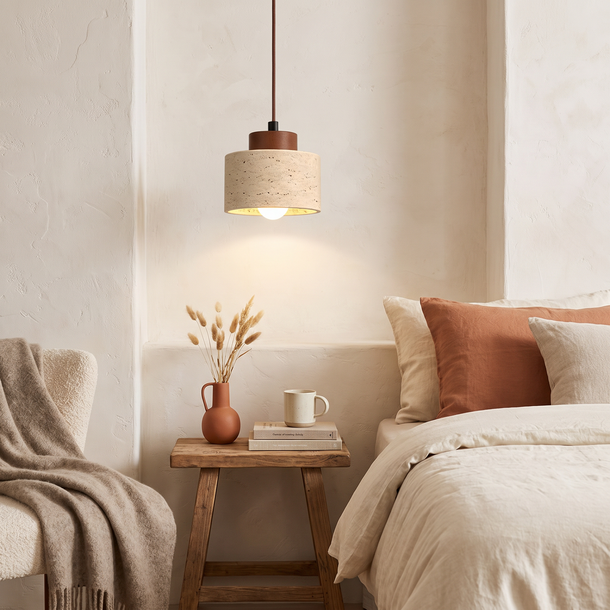 Yellow cave stone wabi-sabi chandelier hanging above a bedside reading nook