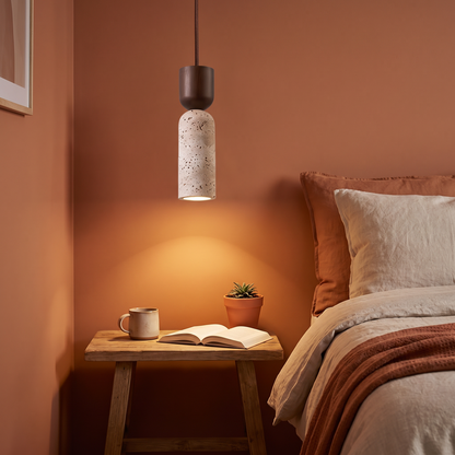 French style wabi-sabi bedside chandelier hanging above a nightstand