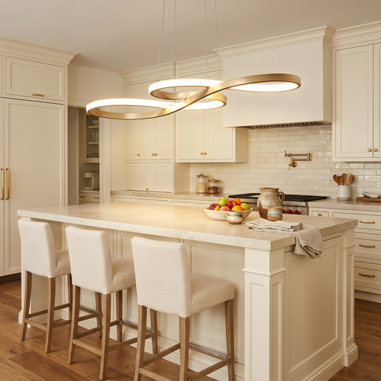 Modern gold pendant light hanging above a kitchen island with warm ambient glow